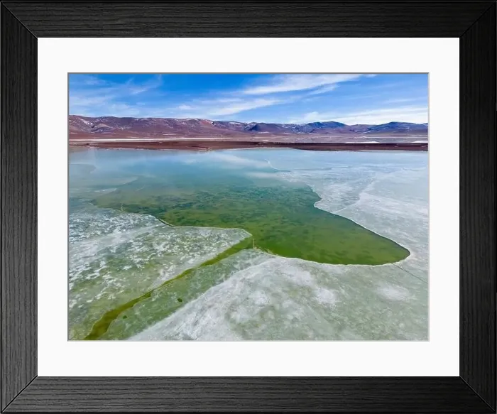 Framed Print : Aerial view of the green and partly frozen Laguna del Negro Francisco in the Atacama desert in Chile - Traveling