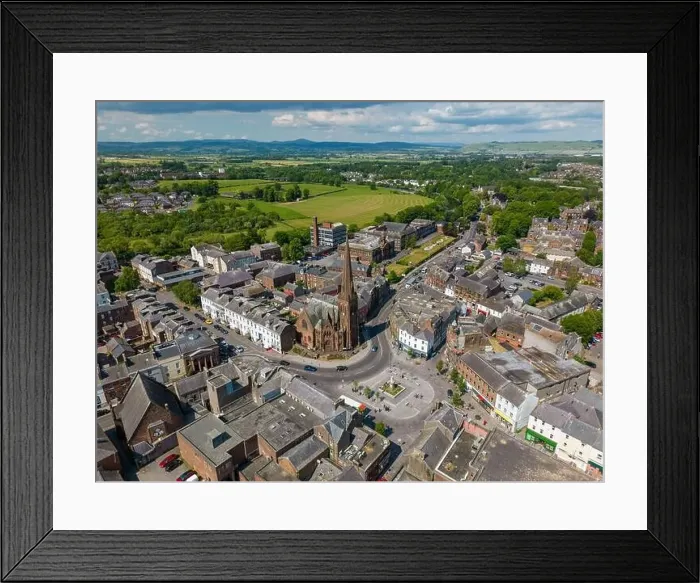 Framed Print : Aerial drone photo of the city centre of Dumfries in Scotland. There is a church located next to a town square Framed Print : Aerial drone photo of the city centre of Dumfries in Scotland. There is a church located next to a town square