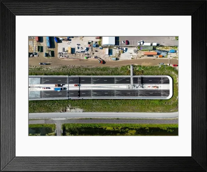 Framed Print : Aerial drone photo of a highway which goes into a tunnel seen from above Framed Print : Aerial drone photo of a highway which goes into a tunnel seen from above