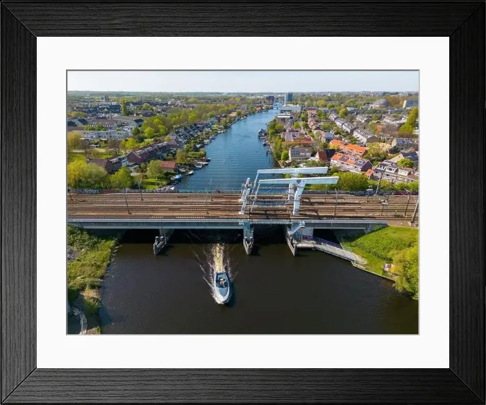 Framed Print : Aerial drone photo of a railway bridge. The bridge is named de Vink and is located in Leiden, the Netherlands Framed Print : Aerial drone photo of a railway bridge. The bridge is named de Vink and is located in Leiden, the Netherlands