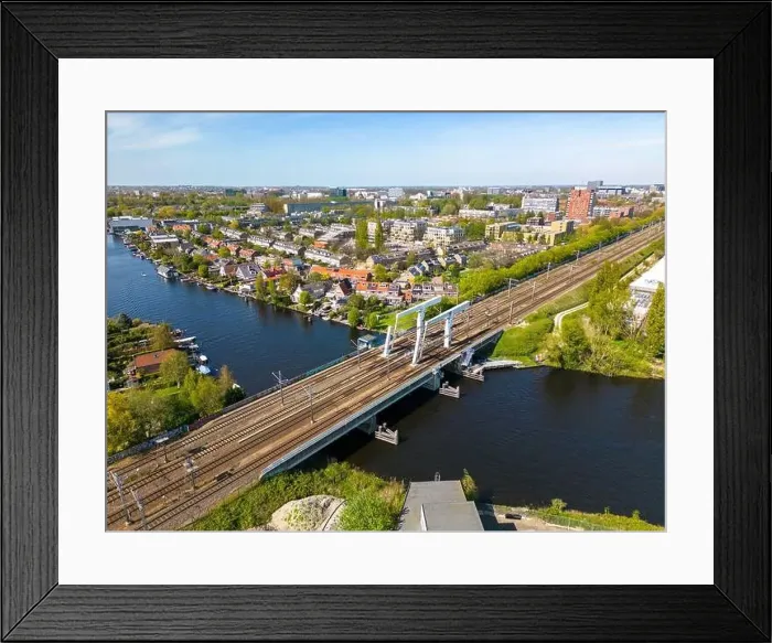 Framed Print : Aerial drone photo of a railway bridge. The bridge is named de Vink and is located in Leiden, the Netherlands Framed Print : Aerial drone photo of a railway bridge. The bridge is named de Vink and is located in Leiden, the Netherlands