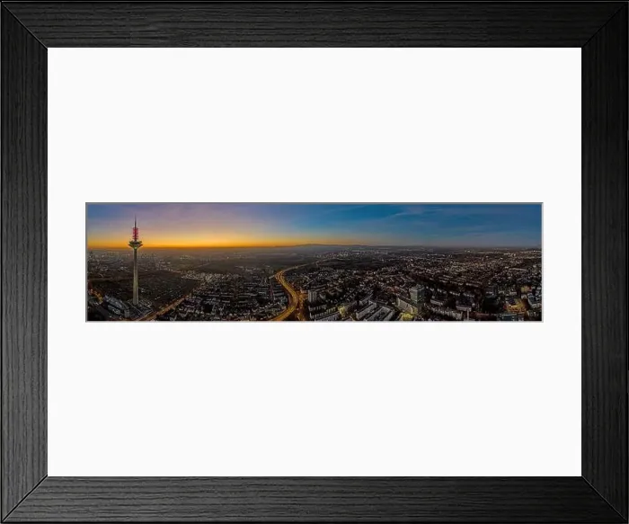 Framed Print : Panoramic drone image of the Frankfurt skyline with television tower in the evening during a colorful Framed Print : Panoramic drone image of the Frankfurt skyline with television tower in the evening during a colorful