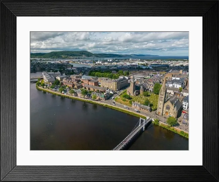 Framed Print : Aerial drone photo of the town centre and churches in Inverness next to the river Ness in Scotland Framed Print : Aerial drone photo of the town centre and churches in Inverness next to the river Ness in Scotland