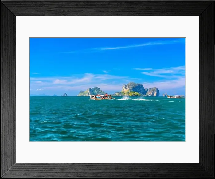 Framed Print : Men in long tail boats with Ko Poda and Ko Kai Chicken Island in the background Framed Print : Men in long tail boats with Ko Poda and Ko Kai Chicken Island in the background