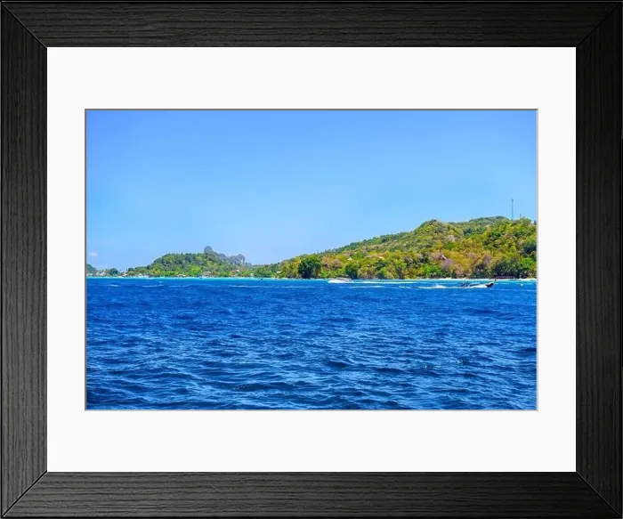 Framed Print : Motor ship in the bay of Ko Phi Phi Don Island with huge rocks and cliffs on a sunny day Framed Print : Motor ship in the bay of Ko Phi Phi Don Island with huge rocks and cliffs on a sunny day