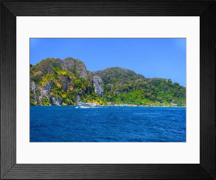 Framed Print : Motor ship in the bay of Ko Phi Phi Don Island with huge rocks and cliffs on a sunny day Framed Print : Motor ship in the bay of Ko Phi Phi Don Island with huge rocks and cliffs on a sunny day