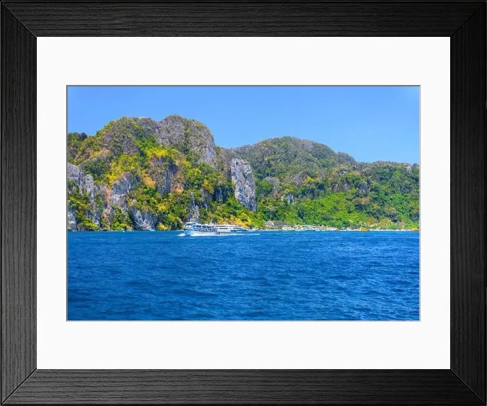 Framed Print : Motor ship in the bay of Ko Phi Phi Don Island with huge rocks and cliffs on a sunny day Framed Print : Motor ship in the bay of Ko Phi Phi Don Island with huge rocks and cliffs on a sunny day