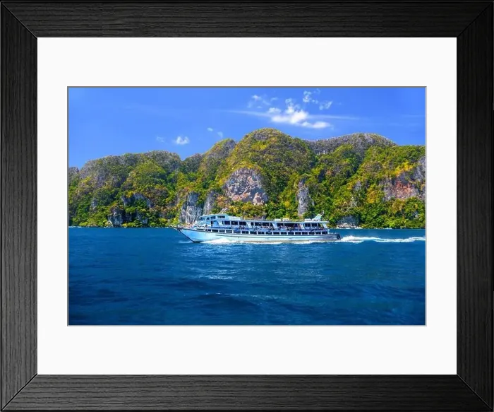 Framed Print : Motor ship in the bay of Ko Phi Phi Don Island with huge rocks and cliffs on a sunny day Framed Print : Motor ship in the bay of Ko Phi Phi Don Island with huge rocks and cliffs on a sunny day