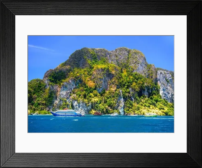 Framed Print : Motor ship in the bay of Ko Phi Phi Don Island with huge rocks and cliffs on a sunny day Framed Print : Motor ship in the bay of Ko Phi Phi Don Island with huge rocks and cliffs on a sunny day
