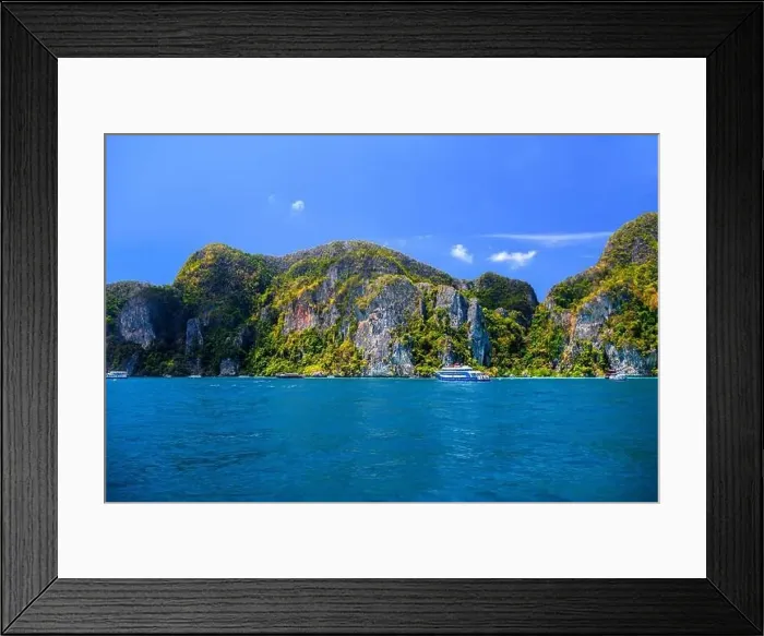 Framed Print : Motor ship in the bay of Ko Phi Phi Don Island with huge rocks and cliffs on a sunny day Framed Print : Motor ship in the bay of Ko Phi Phi Don Island with huge rocks and cliffs on a sunny day