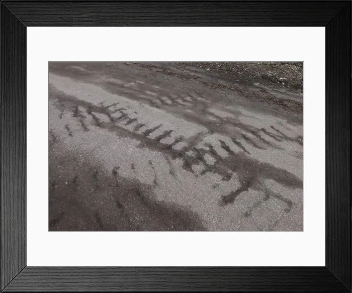 Framed Print : Traces of military vehicles on the asphalt, war in Ukraine