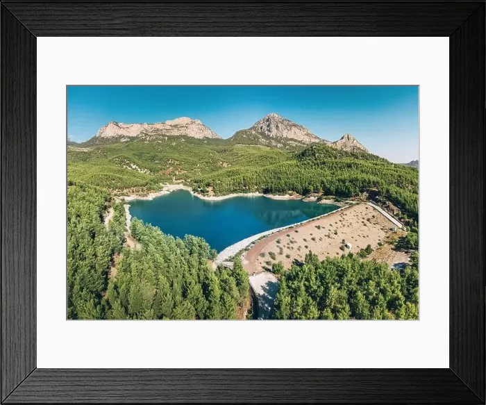 Framed Print : Aerial view of the reservoir pond with beautiful bluish green water among the mountains Framed Print : Aerial view of the reservoir pond with beautiful bluish green water among the mountains