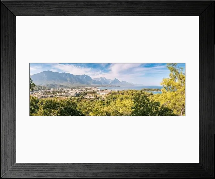 Framed Print : a panoramic vista of Kemer's hotels harmoniously nestled between a picturesque sea beach and awe-inspiring mountains Framed Print : a panoramic vista of Kemer's hotels harmoniously nestled between a picturesque sea beach and awe-inspiring mountains