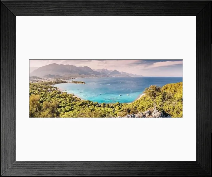 Framed Print : a panoramic vista of Kemer's hotels harmoniously nestled between a picturesque sea beach and awe-inspiring mountains Framed Print : a panoramic vista of Kemer's hotels harmoniously nestled between a picturesque sea beach and awe-inspiring mountains