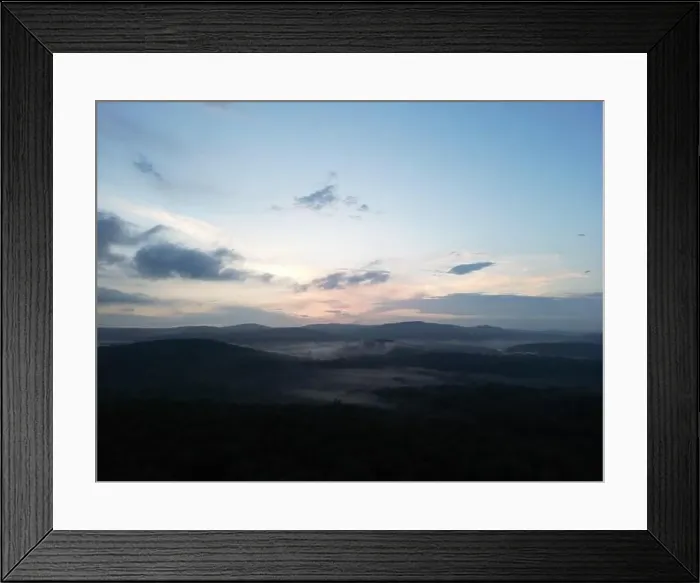 Framed Print : Drone picture of a foggy valley with rolling hills during sunset Framed Print : Drone picture of a foggy valley with rolling hills during sunset