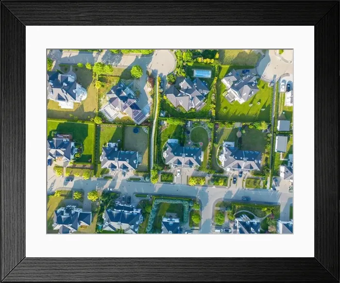 Framed Print : Aerial of new construction luxury residential neighborhood street single family homes real estate Framed Print : Aerial of new construction luxury residential neighborhood street single family homes real estate