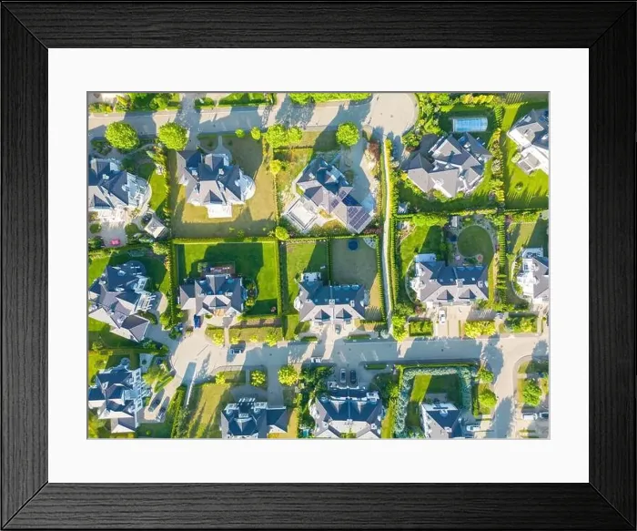 Framed Print : Aerial of new construction luxury residential neighborhood street single family homes real estate Framed Print : Aerial of new construction luxury residential neighborhood street single family homes real estate
