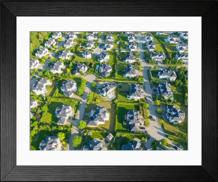 Framed Print : Aerial of new construction luxury residential neighborhood street single family homes real estate Framed Print : Aerial of new construction luxury residential neighborhood street single family homes real estate