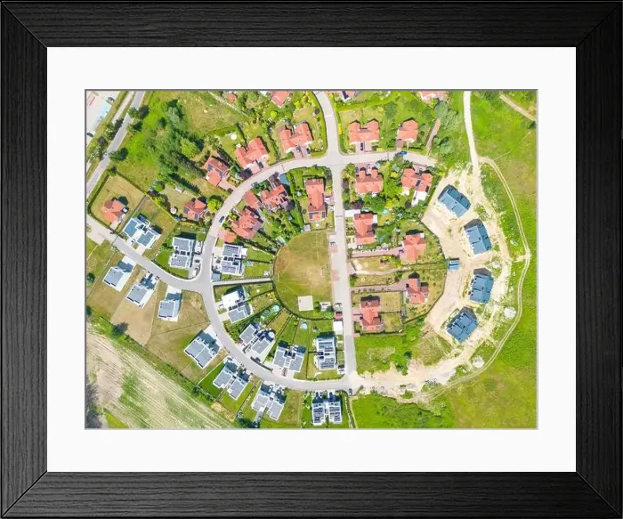 Framed Print : Aerial of new construction luxury residential neighborhood street single family homes real estate