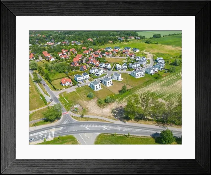 Framed Print : Aerial of new construction luxury residential neighborhood street single family homes real estate Framed Print : Aerial of new construction luxury residential neighborhood street single family homes real estate