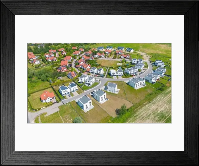 Framed Print : Aerial of new construction luxury residential neighborhood street single family homes real estate Framed Print : Aerial of new construction luxury residential neighborhood street single family homes real estate