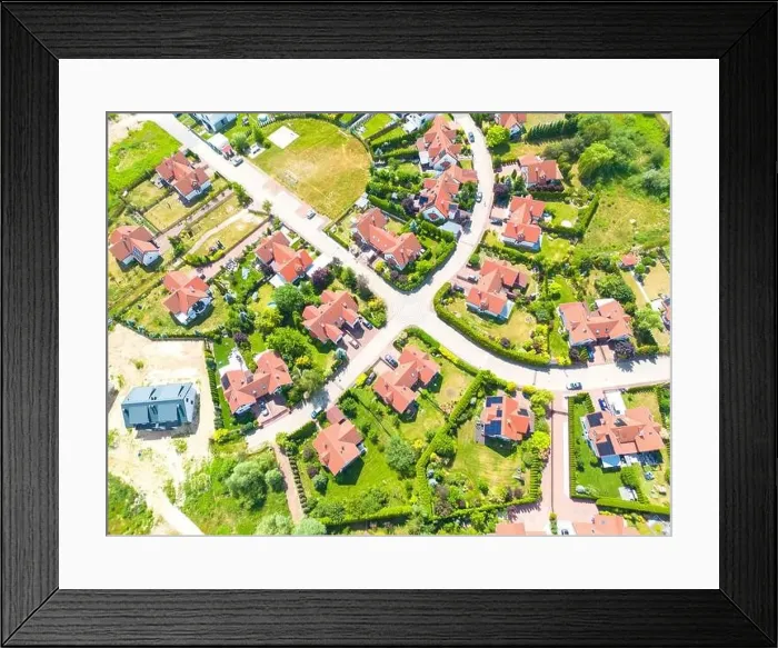 Framed Print : Aerial of new construction luxury residential neighborhood street single family homes real estate Framed Print : Aerial of new construction luxury residential neighborhood street single family homes real estate