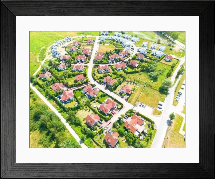 Framed Print : Aerial of new construction luxury residential neighborhood street single family homes real estate Framed Print : Aerial of new construction luxury residential neighborhood street single family homes real estate