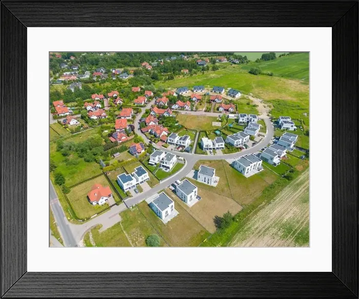 Framed Print : Aerial of new construction luxury residential neighborhood street single family homes real estate Framed Print : Aerial of new construction luxury residential neighborhood street single family homes real estate