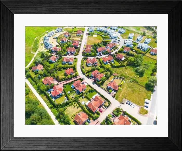 Framed Print : Aerial of new construction luxury residential neighborhood street single family homes real estate Framed Print : Aerial of new construction luxury residential neighborhood street single family homes real estate