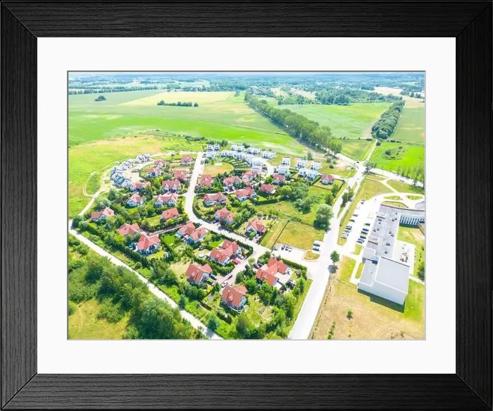 Framed Print : Aerial of new construction luxury residential neighborhood street single family homes real estate Framed Print : Aerial of new construction luxury residential neighborhood street single family homes real estate