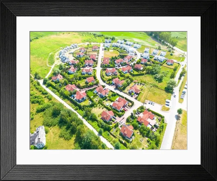 Framed Print : Aerial of new construction luxury residential neighborhood street single family homes real estate Framed Print : Aerial of new construction luxury residential neighborhood street single family homes real estate
