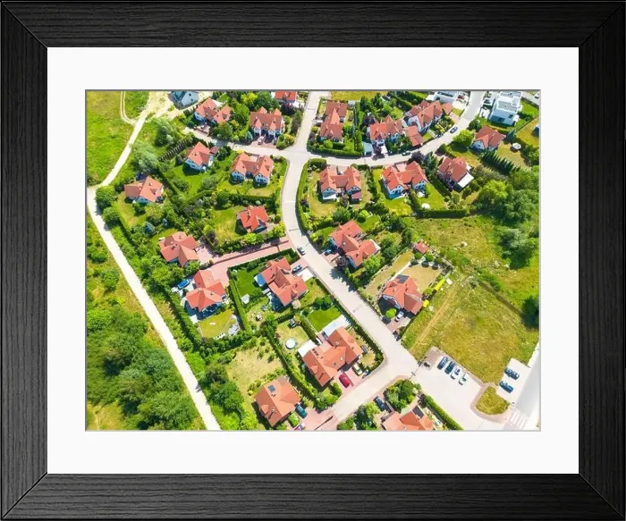 Framed Print : Aerial of new construction luxury residential neighborhood street single family homes real estate Framed Print : Aerial of new construction luxury residential neighborhood street single family homes real estate