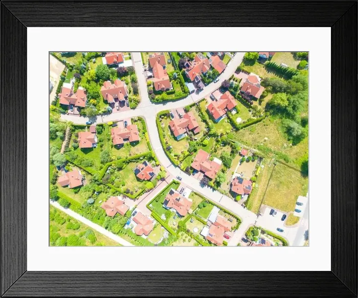 Framed Print : Aerial of new construction luxury residential neighborhood street single family homes real estate Framed Print : Aerial of new construction luxury residential neighborhood street single family homes real estate