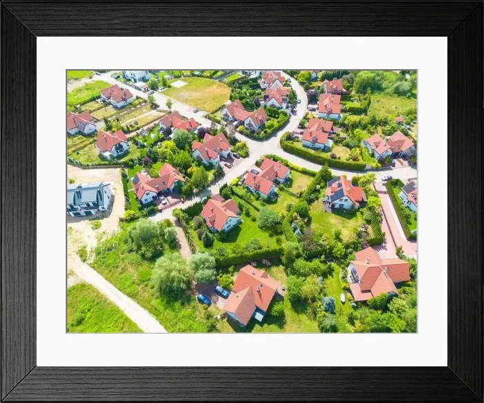 Framed Print : Aerial of new construction luxury residential neighborhood street single family homes real estate Framed Print : Aerial of new construction luxury residential neighborhood street single family homes real estate