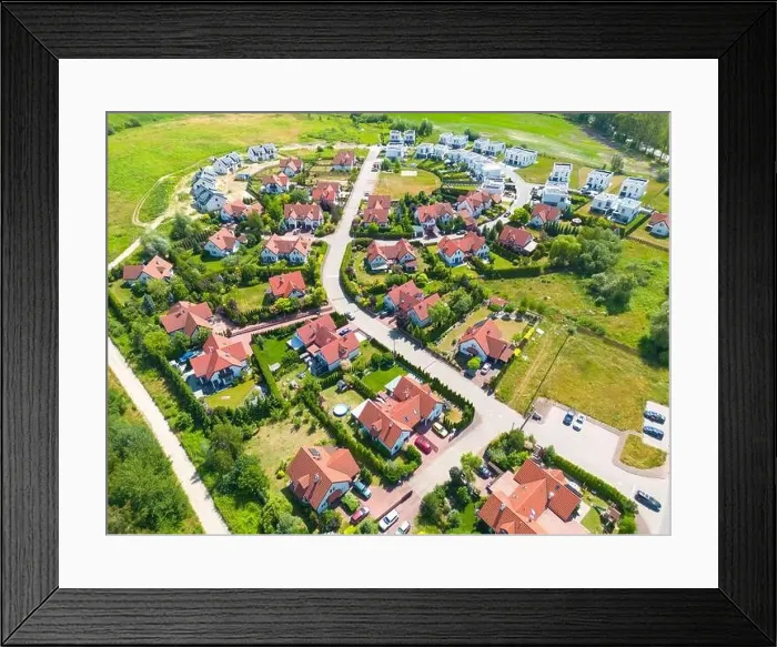 Framed Print : Aerial of new construction luxury residential neighborhood street single family homes real estate Framed Print : Aerial of new construction luxury residential neighborhood street single family homes real estate