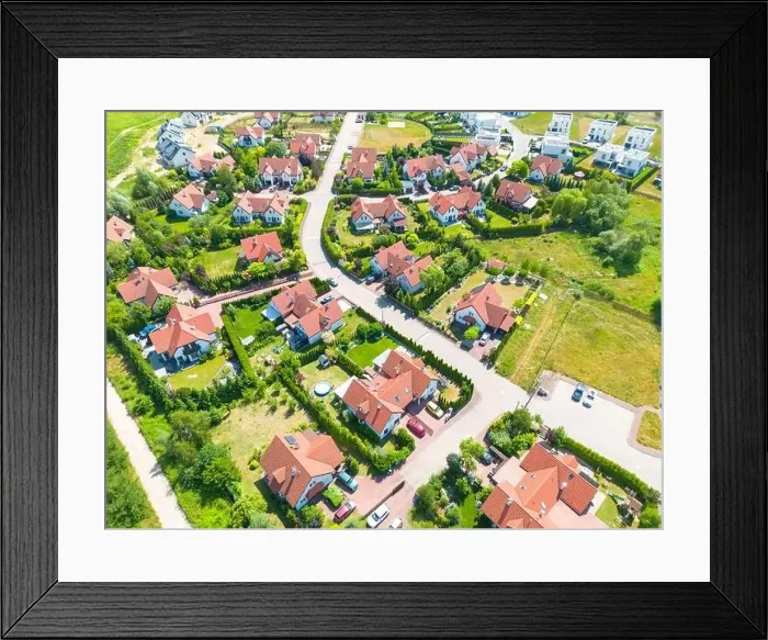 Framed Print : Aerial of new construction luxury residential neighborhood street single family homes real estate Framed Print : Aerial of new construction luxury residential neighborhood street single family homes real estate