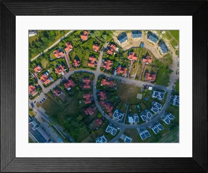 Framed Print : Aerial of new construction luxury residential neighborhood street single family homes real estate Framed Print : Aerial of new construction luxury residential neighborhood street single family homes real estate