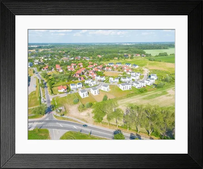 Framed Print : Aerial of new construction luxury residential neighborhood street single family homes real estate Framed Print : Aerial of new construction luxury residential neighborhood street single family homes real estate