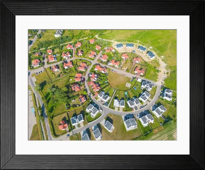 Framed Print : Aerial of new construction luxury residential neighborhood street single family homes real estate Framed Print : Aerial of new construction luxury residential neighborhood street single family homes real estate