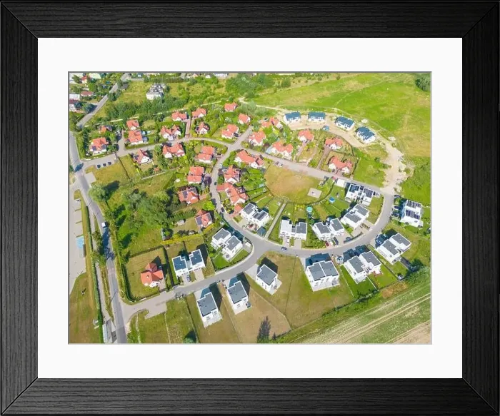 Framed Print : Aerial of new construction luxury residential neighborhood street single family homes real estate Framed Print : Aerial of new construction luxury residential neighborhood street single family homes real estate