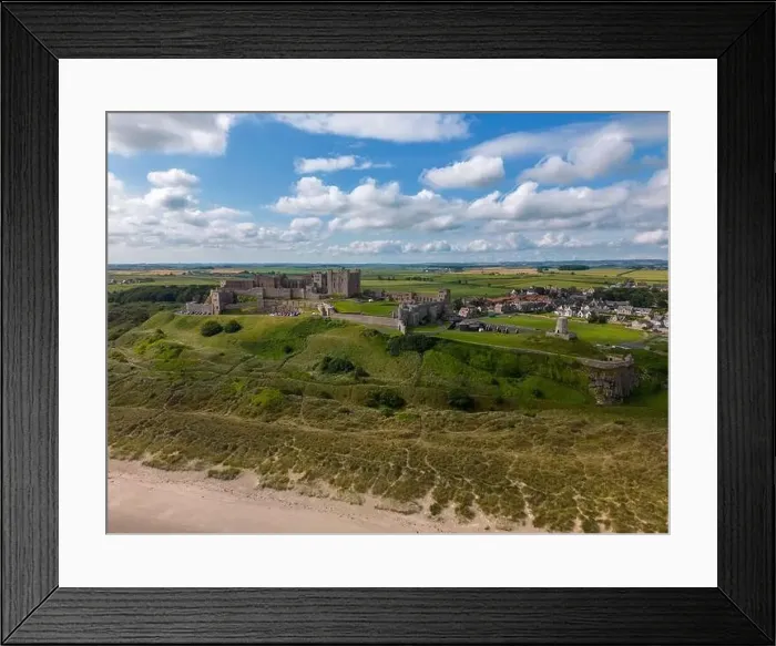 Framed Print : Aerial drone photo of Bamburgh Castle at the beautiful coastline of Northumberland Framed Print : Aerial drone photo of Bamburgh Castle at the beautiful coastline of Northumberland