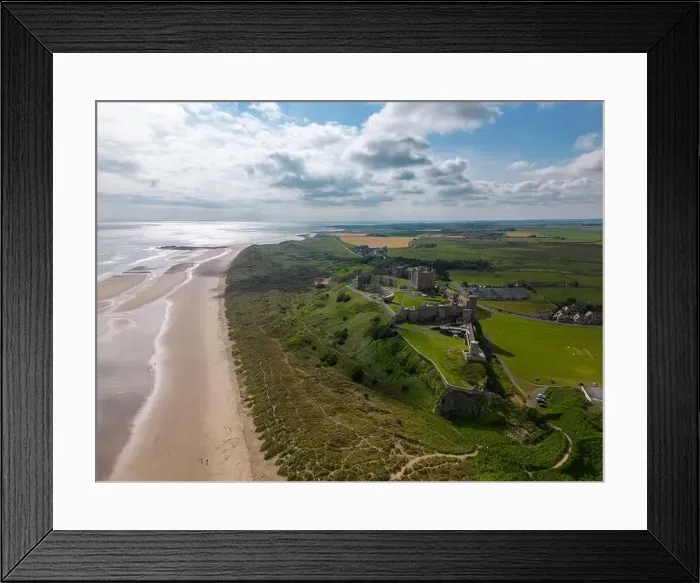 Framed Print : Aerial drone photo of Bamburgh Castle at the beautiful coastline of Northumberland Framed Print : Aerial drone photo of Bamburgh Castle at the beautiful coastline of Northumberland