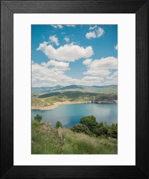 Framed Print : Aerial view of breathtaking scenery of calm lake with water located in mountainous valley with green trees Framed Print : Aerial view of breathtaking scenery of calm lake with water located in mountainous valley with green trees
