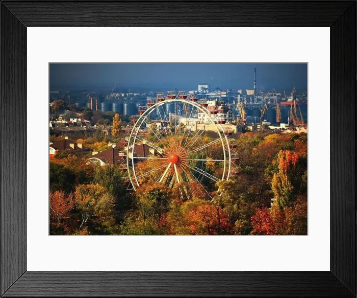 Framed Print : Ferris wheel and roofs of houses in the autumn park from a bird's eye view Framed Print : Ferris wheel and roofs of houses in the autumn park from a bird's eye view