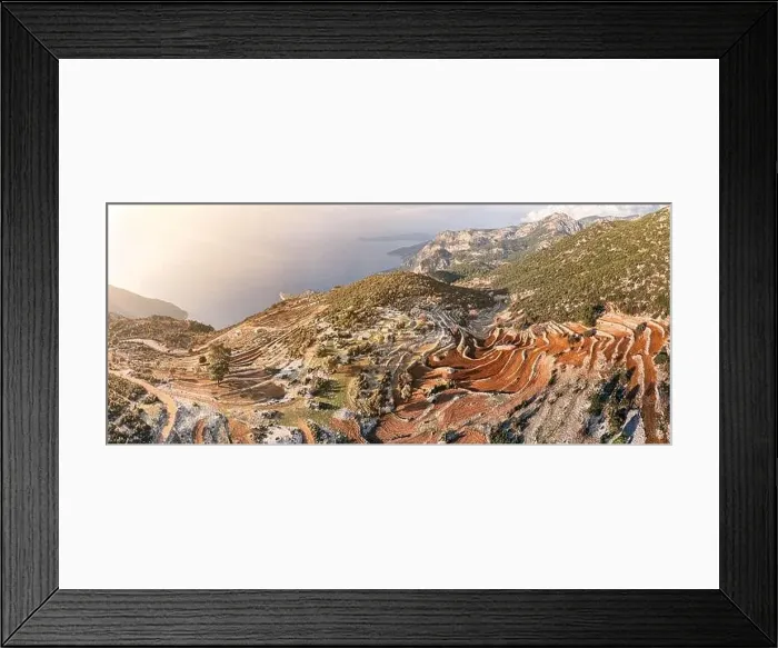 Framed Print : From above, the mesmerizing sight of a plowed field with terraces on the hills unfolds Framed Print : From above, the mesmerizing sight of a plowed field with terraces on the hills unfolds