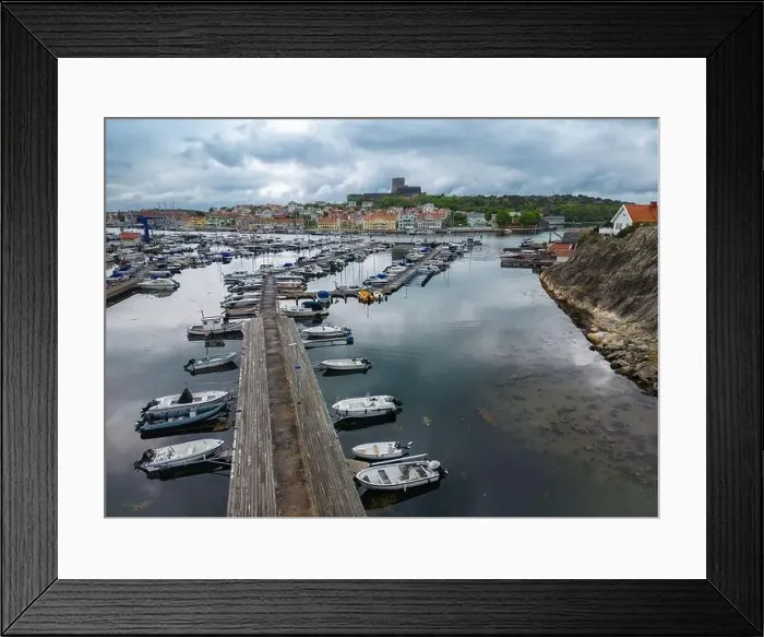 Framed Print : Marstrand, Sweden - May 22, 2023: The port and a view at the castle of a small island and town of Marstrand