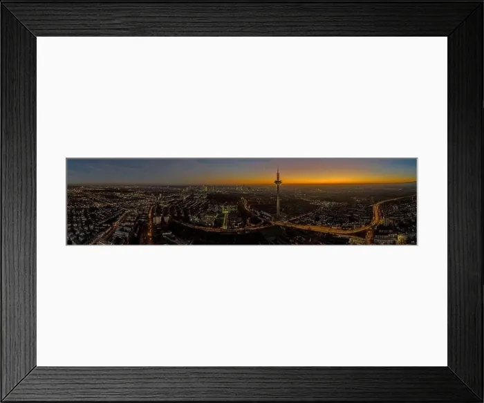 Framed Print : Panoramic drone image of the Frankfurt skyline with television tower in the evening during a colorful Framed Print : Panoramic drone image of the Frankfurt skyline with television tower in the evening during a colorful
