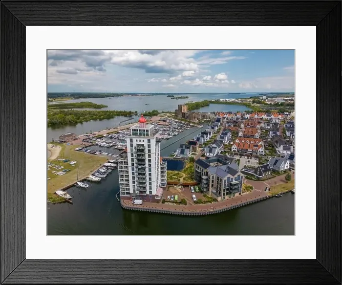 Framed Print : Aerial drone photo of an apartment building that looks like a lighthouse in Harderwijk, the Netherlands Framed Print : Aerial drone photo of an apartment building that looks like a lighthouse in Harderwijk, the Netherlands