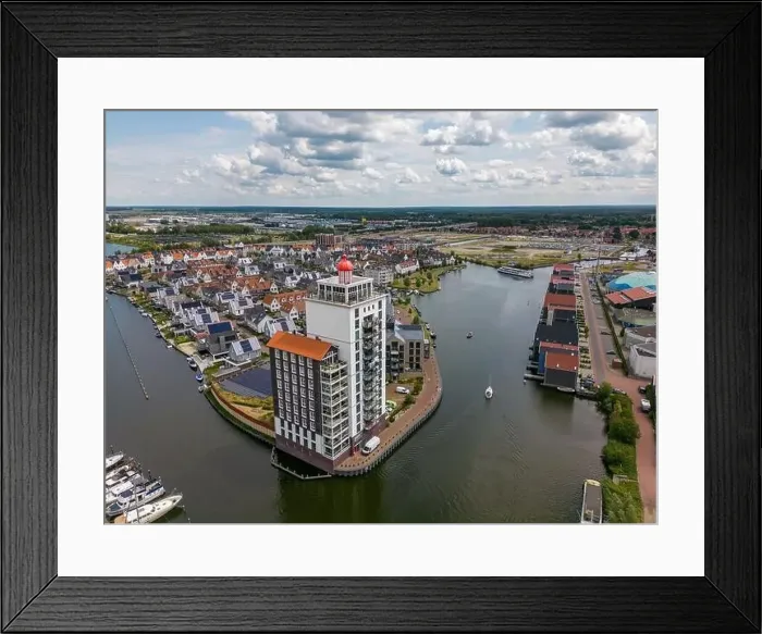 Framed Print : Aerial drone photo of an apartment building that looks like a lighthouse in Harderwijk, the Netherlands Framed Print : Aerial drone photo of an apartment building that looks like a lighthouse in Harderwijk, the Netherlands