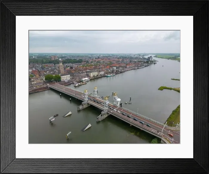 Framed Print : Aerial drone video of the bridge over the river Ijssel in Kampen. Kampen is a city in Overijssel, the Netherlands Framed Print : Aerial drone video of the bridge over the river Ijssel in Kampen. Kampen is a city in Overijssel, the Netherlands